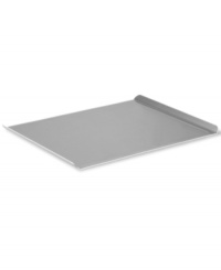 Welcome to a world of baked greats! Perfect for cookies, dinner rolls, pastries and beyond, this large cookie sheet features two upturned ends for easy lifting and open sides, so food slides right off. Crafted with a heavy-gauge steel core for even heating, this pan features two interlocking layers of professional nonstick for gentle release. Lifetime warranty. Welcome to a world of baked greats! Perfect for cookies, dinner rolls, pastries and beyond, this large cookie sheet features two upturned ends for easy lifting and open sides, so food slides right off. Crafted with a heavy-gauge steel core for even heating, this pan features two interlocking layers of professional nonstick for gentle release. Lifetime warranty.