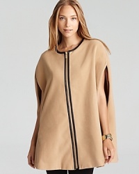 Go strikingly oversize in a sumptuous Calvin Klein cape, embellished with faux-leather trim for contemporary edge. Go strikingly oversize in a sumptuous Calvin Klein cape, embellished with faux-leather trim for contemporary edge.