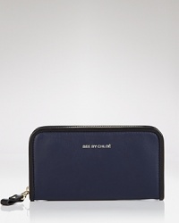 Simple style has never looked go good. Go back to basics with the essential wallet from See by Chloé, featuring a rich leathery look and multiple interior pockets. Simple style has never looked go good. Go back to basics with the essential wallet from See by Chloé, featuring a rich leathery look and multiple interior pockets.