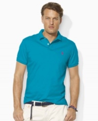 A classic short-sleeved polo shirt is cut for a trim, modern fit in smooth, soft cotton interlock. A classic short-sleeved polo shirt is cut for a trim, modern fit in smooth, soft cotton interlock.