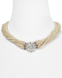Varied strands of creamy glass pearls on this Carolee necklace comprise an elegant torsade, accented by an ornate floral closure. Varied strands of creamy glass pearls on this Carolee necklace comprise an elegant torsade, accented by an ornate floral closure.