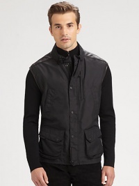 Supple Italian lambskin accents lend rugged refinement to a trim-fitting vest, exquisitely crafted from lightly filled microfiber for a sleek finishing look.Zip frontSnap-button placketStand collarSlashed chest, waist flap pockets90% nylon/10% polyurethaneDry cleanImported Supple Italian lambskin accents lend rugged refinement to a trim-fitting vest, exquisitely crafted from lightly filled microfiber for a sleek finishing look.Zip frontSnap-button placketStand collarSlashed chest, waist flap pockets90% nylon/10% polyurethaneDry cleanImported