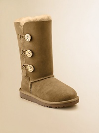 Twin-faced sheepskin will keep cute little feet naturally warm updated with a wooden button and loop closure for easy on and off.Twin-face sheepskin upper Logo button and loop closure Molded EVA sole Suede heel guards Woven label on heel Imported Twin-faced sheepskin will keep cute little feet naturally warm updated with a wooden button and loop closure for easy on and off.Twin-face sheepskin upper Logo button and loop closure Molded EVA sole Suede heel guards Woven label on heel Imported