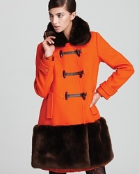A shockingly chic approach to cold weather, this kate spade new york coat strikes at a distance with plush faux-fur trim and a bold, boxy silhouette. A shockingly chic approach to cold weather, this kate spade new york coat strikes at a distance with plush faux-fur trim and a bold, boxy silhouette.