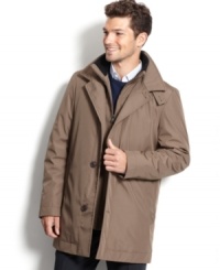 Stay dry on the outside and keep your gadgets safe on the inside with this multi-pocketed Calvin Klein raincoat. Stay dry on the outside and keep your gadgets safe on the inside with this multi-pocketed Calvin Klein raincoat.