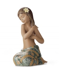 Lladro captures a different type of beauty from the South Pacific in this handcrafted porcelain figurine. With a pretty wrap skirt and flower in her hair, she's the picture of serenity. Lladro captures a different type of beauty from the South Pacific in this handcrafted porcelain figurine. With a pretty wrap skirt and flower in her hair, she's the picture of serenity.