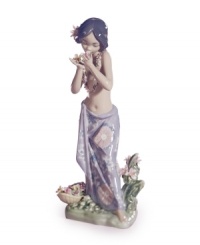 Hawaii beckons. A young hula dancer stops to smell the orchids in this fanciful collectible, handcrafted in exquisite Lladro porcelain. Hawaii beckons. A young hula dancer stops to smell the orchids in this fanciful collectible, handcrafted in exquisite Lladro porcelain.