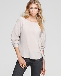 Nothing feels more luxurious than pure silk against your skin--we're obsessed with this Vince blouse for its simple structure and alluring neckline. Nothing feels more luxurious than pure silk against your skin--we're obsessed with this Vince blouse for its simple structure and alluring neckline.