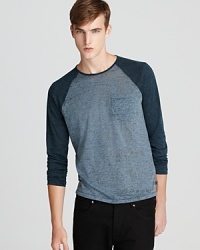This thin, lightweight tee boasts a vintage sporty feel with contrast raglan sleeves like your old little league jersey – a touch of nostalgia with plenty of modern appeal. This thin, lightweight tee boasts a vintage sporty feel with contrast raglan sleeves like your old little league jersey – a touch of nostalgia with plenty of modern appeal.