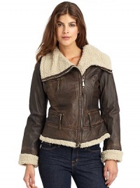 THE LOOKContrasting faux shearling liningAsymmetric zip frontDual zip pocketsBuckle accents at back hemTHE FITAbout 22 from shoulder to hemTHE MATERIALBody: leatherTrim: acrylicFully linedCARE & ORIGINClean by leather specialistImportedModel shown is 5'9 (175cm) wearing US size Small. THE LOOKContrasting faux shearling liningAsymmetric zip frontDual zip pocketsBuckle accents at back hemTHE FITAbout 22 from shoulder to hemTHE MATERIALBody: leatherTrim: acrylicFully linedCARE & ORIGINClean by leather specialistImportedModel shown is 5'9 (175cm) wearing US size Small.