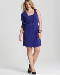 Fluid draping lends ethereal elegance to this DKNYC Plus dress, while a jewel-toned hue elevates the style to head-turning status. Fluid draping lends ethereal elegance to this DKNYC Plus dress, while a jewel-toned hue elevates the style to head-turning status.