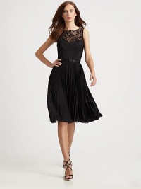 A flared, crisply pleated skirt is crowned with an alluring illusion lace bodice.Bateau necklineSleevelessIllusion sweetheart necklineSatin beltPleated skirtScooped back with concealed zipFully linedAbout 26 from natural waist60% nylon/40% rayonDry cleanImported of domestic fabricModel shown is 5'10 (177cm) wearing US size 4. A flared, crisply pleated skirt is crowned with an alluring illusion lace bodice.Bateau necklineSleevelessIllusion sweetheart necklineSatin beltPleated skirtScooped back with concealed zipFully linedAbout 26 from natural waist60% nylon/40% rayonDry cleanImported of domestic fabricModel shown is 5'10 (177cm) wearing US size 4.