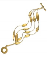 Rows of radiant light, by Charter Club. This four-row bracelet displays brushed oval accents for a lovely look. Finished with a toggle closure. Crafted in brushed gold tone mixed metal. Approximate length: 6 inches. Rows of radiant light, by Charter Club. This four-row bracelet displays brushed oval accents for a lovely look. Finished with a toggle closure. Crafted in brushed gold tone mixed metal. Approximate length: 6 inches.