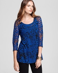 Lined with a seamless lockstitched shapewear tank to slim the figure, this Miraclebody by Miraclesuit top makes a bold impression with a sheer burnout print. Lined with a seamless lockstitched shapewear tank to slim the figure, this Miraclebody by Miraclesuit top makes a bold impression with a sheer burnout print.