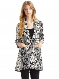 THE LOOKExotic, geometric pattern throughoutDeep V necklineButton frontElbow-length sleeves with turn-back cuffsDual patch pockets at frontTHE FITAbout 28½ from shoulder to hemTHE MATERIALSilkCARE & ORIGINDry cleanImportedOUR FIT MODEL RECOMMENDS ordering one size up as this style runs small. THE LOOKExotic, geometric pattern throughoutDeep V necklineButton frontElbow-length sleeves with turn-back cuffsDual patch pockets at frontTHE FITAbout 28½ from shoulder to hemTHE MATERIALSilkCARE & ORIGINDry cleanImportedOUR FIT MODEL RECOMMENDS ordering one size up as this style runs small.