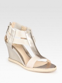 A demi-wedge lifts this t-strap silhouette rendered in opalescent leather with textured rope edging. Self-covered wedge, 2¾ (70mm)Pearlized patent leather upper with elastic straps and espadrille trimBack zipLeather lining and solePadded insoleMade in Italy