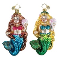 Celebrate Christmas by the seashore with this shimmering mermaid ornament, iridescent seashell in hand. Celebrate Christmas by the seashore with this shimmering mermaid ornament, iridescent seashell in hand.