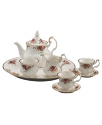 Garnished with the popular Old Country Roses dinnerware pattern, this bone china tea set from Royal Albert serveware brings the bounty of the English countryside to traditional afternoon tea. Scalloped rims and sculpted handles glisten in 22K gold. Garnished with the popular Old Country Roses dinnerware pattern, this bone china tea set from Royal Albert serveware brings the bounty of the English countryside to traditional afternoon tea. Scalloped rims and sculpted handles glisten in 22K gold.