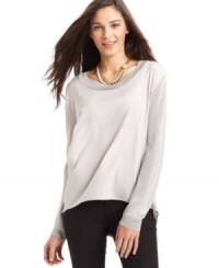 AGB's latest top features a high-low hem and contrasting materials to add a chic touch to your outfit. AGB's latest top features a high-low hem and contrasting materials to add a chic touch to your outfit.