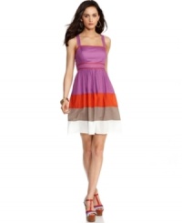 Jessica Simpson's A-line dress features a bold colorblocked stripe at the skirt that's accentuated by bright, contrasting piping at the bodice. Jessica Simpson's A-line dress features a bold colorblocked stripe at the skirt that's accentuated by bright, contrasting piping at the bodice.