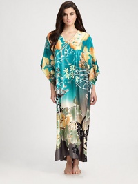 Vivid florals transform this comfortable design in smooth, easy-to-wear fabric. V-neckThree-quarter kimono sleevesAbout 52 from shoulder to hemPolyesterMachine washImported