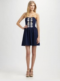 An alluring strapless top with fascinating embroidery and a body-hugging fit leads to a full skirt for a timeless silhouette.Sweetheart necklineEmbroidered detailsFull skirtConcealed back zipperFully linedAbout 18 from natural waistCottonHand washImported Model shown is 5'10 (177cm) wearing US size 4. An alluring strapless top with fascinating embroidery and a body-hugging fit leads to a full skirt for a timeless silhouette.Sweetheart necklineEmbroidered detailsFull skirtConcealed back zipperFully linedAbout 18 from natural waistCottonHand washImported Model shown is 5'10 (177cm) wearing US size 4.