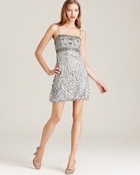 A lavishly embellished bodice tops off a rosette-adorned skirt to stunning perfection on this Sue Wong strapless dress. A lavishly embellished bodice tops off a rosette-adorned skirt to stunning perfection on this Sue Wong strapless dress.