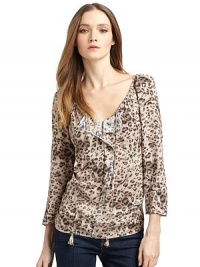 THE LOOKAllover ocelot printThree-quarter length sleevesRuched V-neck with tie closureFront folded ruffle detailFront and back gentle ruchingTHE FITAbout 23 from shoulder to hemTHE MATERIALRayonSecond fabric: 65% viscose/35% silkCARE & ORIGINDry cleanImportedModel shown is 5'10½ (179cm) wearing US size 4. THE LOOKAllover ocelot printThree-quarter length sleevesRuched V-neck with tie closureFront folded ruffle detailFront and back gentle ruchingTHE FITAbout 23 from shoulder to hemTHE MATERIALRayonSecond fabric: 65% viscose/35% silkCARE & ORIGINDry cleanImportedModel shown is 5'10½ (179cm) wearing US size 4.