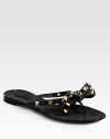 Low-cut silhouette sprinkled in edgy studs, topped with a signature bow. Studded PVC upperPVC lining and solePadded insoleMade in ItalyOUR FIT MODEL RECOMMENDS ordering one half size down as this style runs large. 