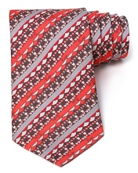 A dramatic and ornate design patterns into stripes on this super-lavish tie from Emilio Pucci, cut from brilliantly soft Italian silk for a decadent addition to your wardrobe. A dramatic and ornate design patterns into stripes on this super-lavish tie from Emilio Pucci, cut from brilliantly soft Italian silk for a decadent addition to your wardrobe.