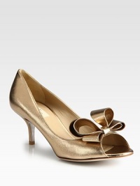Peep toe silhouette of smooth Italian metallic leather, heightened by a large feminine bow. Self-covered heel, 3 (75mm)Metallic leather upperPeep toeLeather lining and solePadded insoleMade in ItalyThis style runs true to size. We recommend ordering your usual size for a standard fit. Peep toe silhouette of smooth Italian metallic leather, heightened by a large feminine bow. Self-covered heel, 3 (75mm)Metallic leather upperPeep toeLeather lining and solePadded insoleMade in ItalyThis style runs true to size. We recommend ordering your usual size for a standard fit.