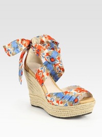 Leather and silk upper in a bold ikat print tops a textured espadrille wedge, finished with silk ties that form a bow at the ankle. Braided hemp wedge, 5 (125mm)Braided hemp platform, 1½ (40mm)Compares to a 3½ heel (90mm)Silk and leather upperLeather liningRubber solePadded insoleImported Leather and silk upper in a bold ikat print tops a textured espadrille wedge, finished with silk ties that form a bow at the ankle. Braided hemp wedge, 5 (125mm)Braided hemp platform, 1½ (40mm)Compares to a 3½ heel (90mm)Silk and leather upperLeather liningRubber solePadded insoleImported