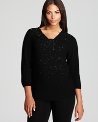 A constellation of beading sparkles from a stunningly draped Eileen Fisher Plus sweater for an effortlessly elegant look. A constellation of beading sparkles from a stunningly draped Eileen Fisher Plus sweater for an effortlessly elegant look.