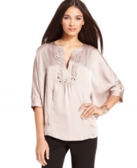 An intricate cutout floral pattern at the neckline gives this flowing Alfani top a romantic feel. Its ultra-feminine approach means it's the perfect way to dress up your black pants. An intricate cutout floral pattern at the neckline gives this flowing Alfani top a romantic feel. Its ultra-feminine approach means it's the perfect way to dress up your black pants.