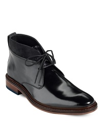 Reboot your professional attire with this superior leather design from Cole Haan, a handsome dress shoe that transitions seamlessly from work environments to cocktail parties. Featuring a modern Chukka silhouette and supportive Nike Air technology for maximum comfort. Reboot your professional attire with this superior leather design from Cole Haan, a handsome dress shoe that transitions seamlessly from work environments to cocktail parties. Featuring a modern Chukka silhouette and supportive Nike Air technology for maximum comfort.