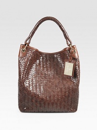 A stunning weave of luxurious burnished Italian leather, constructed in this slouchy shape with an iconic logo luggage tag. Single top handle, 6 dropMagnetic top closureDetachable zipper leather pouchSatin lining16W X 13¾H X 4½DMade in Italy A stunning weave of luxurious burnished Italian leather, constructed in this slouchy shape with an iconic logo luggage tag. Single top handle, 6 dropMagnetic top closureDetachable zipper leather pouchSatin lining16W X 13¾H X 4½DMade in Italy