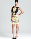 A fitted sheath silhouette takes on a paisley print and a modern asymmetric neckline. From BCBGMAXAZRIA.