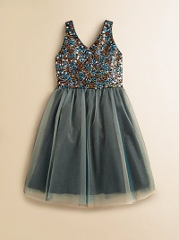 A spectacular, sequined v-neck top is paired with a shimmery, flared skirt to create a stunning, party-ready frock.V-neckSleevelessBack zipperWaistband with ribbon beltFull skirtPolyester/SpandexDry cleanMade in USA of imported fabric A spectacular, sequined v-neck top is paired with a shimmery, flared skirt to create a stunning, party-ready frock.V-neckSleevelessBack zipperWaistband with ribbon beltFull skirtPolyester/SpandexDry cleanMade in USA of imported fabric