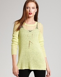 This loose-knit, laid back Free People sweater in a sunny-colored hue is lightweight and layer-perfect for fall. This loose-knit, laid back Free People sweater in a sunny-colored hue is lightweight and layer-perfect for fall.