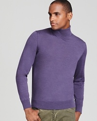 Rendered in virgin merino wool for uncommon softness, this handsome turtleneck acknowledges your taste for classic refinement. Rendered in virgin merino wool for uncommon softness, this handsome turtleneck acknowledges your taste for classic refinement.
