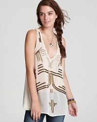 Gold bead embellishments and a plunging V-neckline spice up this Free People tank and your favorite pair of jeans. Gold bead embellishments and a plunging V-neckline spice up this Free People tank and your favorite pair of jeans.