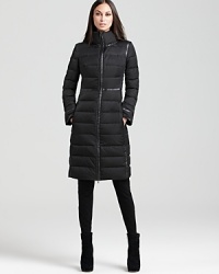 Stave off winter's chill in a decadent DKNY puffer coat, featuring contrast faux-leaher trim to keep things slim. Stave off winter's chill in a decadent DKNY puffer coat, featuring contrast faux-leaher trim to keep things slim.