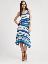 Concluded with a unique handkerchief hem, this stunning scoopneck has an elasticized drop waist and striped print. ScoopneckSleevelessElasticized drop waistAsymmetrical handkerchief hemAbout 38 from natural waist96% rayon/4% spandexHand washMade in USAModel shown is 5'10 (177cm) wearing US size Small. Concluded with a unique handkerchief hem, this stunning scoopneck has an elasticized drop waist and striped print. ScoopneckSleevelessElasticized drop waistAsymmetrical handkerchief hemAbout 38 from natural waist96% rayon/4% spandexHand washMade in USAModel shown is 5'10 (177cm) wearing US size Small.