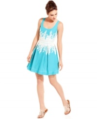 Lush floral embroidery blossoms from the waistband of a breezy scoop-neck dress from Studio M. Showcase this sophisticated style with sparkling accessories that give it a fresh, modern finishing touch. Lush floral embroidery blossoms from the waistband of a breezy scoop-neck dress from Studio M. Showcase this sophisticated style with sparkling accessories that give it a fresh, modern finishing touch.