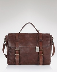 Crafted in distressed leather and vintage-inspired strap and buckle details, the Logan brief case brings that devil-may-care edge to your professional ensemble. Crafted in distressed leather and vintage-inspired strap and buckle details, the Logan brief case brings that devil-may-care edge to your professional ensemble.