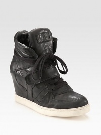 Fronted by laces and a Velcro® strap, this sporty leather sneaker has an unexpected, hidden wedge and rubber sole. Hidden wedge, 3 (75mm)Leather upperLeather liningRubber solePadded insoleImported Fronted by laces and a Velcro® strap, this sporty leather sneaker has an unexpected, hidden wedge and rubber sole. Hidden wedge, 3 (75mm)Leather upperLeather liningRubber solePadded insoleImported