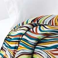 In an array of practically every color under the rainbow, this wild print is sure to fit in any decor. In an array of practically every color under the rainbow, this wild print is sure to fit in any decor.