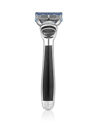 The Power Shave Collection Power Razor with Smart Technology helps you ensure your blade is always sharp. The built-in indicator light begins to fade from vibrant blue to white with every razor use to take the guesswork out of when to consider changing your blade. The handle, balanced and weighted to feel like a natural extension of your hand, is ergonomically designed with micro-textured surface accents for style, precision and control. The spotlight reveals details normally in shadow to help you avoid missed spots while gentle micro-pulses help you reduce friction and increase razor glide. The sleek, contemporary handle is expertly crafted in polished chrome and black lacquered accents. The Power Shave Collection Power Razor with Smart Technology helps you ensure your blade is always sharp. The built-in indicator light begins to fade from vibrant blue to white with every razor use to take the guesswork out of when to consider changing your blade. The handle, balanced and weighted to feel like a natural extension of your hand, is ergonomically designed with micro-textured surface accents for style, precision and control. The spotlight reveals details normally in shadow to help you avoid missed spots while gentle micro-pulses help you reduce friction and increase razor glide. The sleek, contemporary handle is expertly crafted in polished chrome and black lacquered accents.