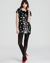 A modern rendition of polka dots, this Juicy Couture dress shines with oversized sequin pailettes for chic luster.