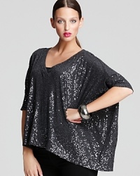 Dripping with dazzle, this DKNY top illuminates your every look with a fluid dolman silhouette. Slip on the luxe layer for an instant style statement. Dripping with dazzle, this DKNY top illuminates your every look with a fluid dolman silhouette. Slip on the luxe layer for an instant style statement.